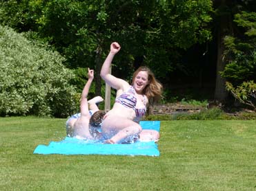 water slide in garden by pool